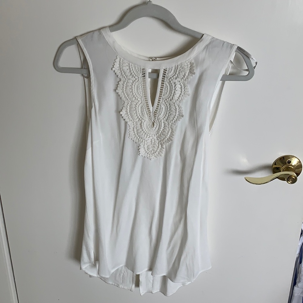 Cream sleeveless blouse with crochet detailing